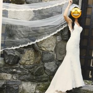 Wedding dress and Veil from Bridal Reflections.